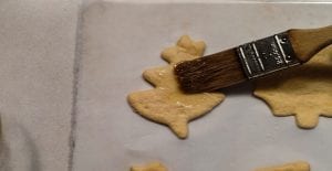 applying butter to fall rolls