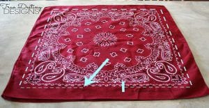 Red, white, and blue bandannas can easily be crafted into pillows using these steps.
