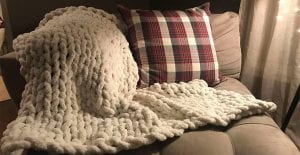 This DIY knit blanket is the perfect addition to any room.