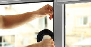 Applying weather stripping to window