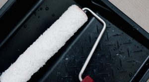 A paint roller can apply outdoor wood stain.
