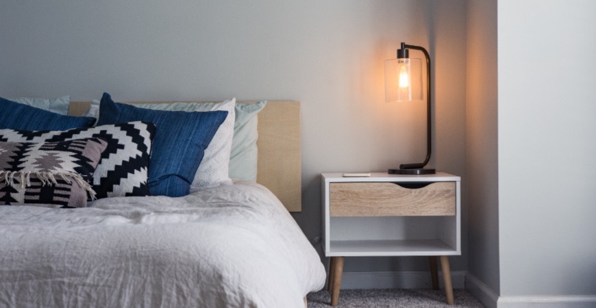 A simple bedside lamp can set appropriate ambience.
