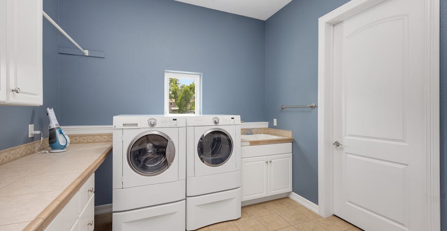 A clean and organized laundry room makes laundry easier.