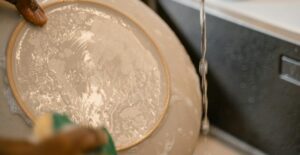 Washing dishes every day keeps a kitchen clean.