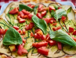 A pizza topped with a garden.